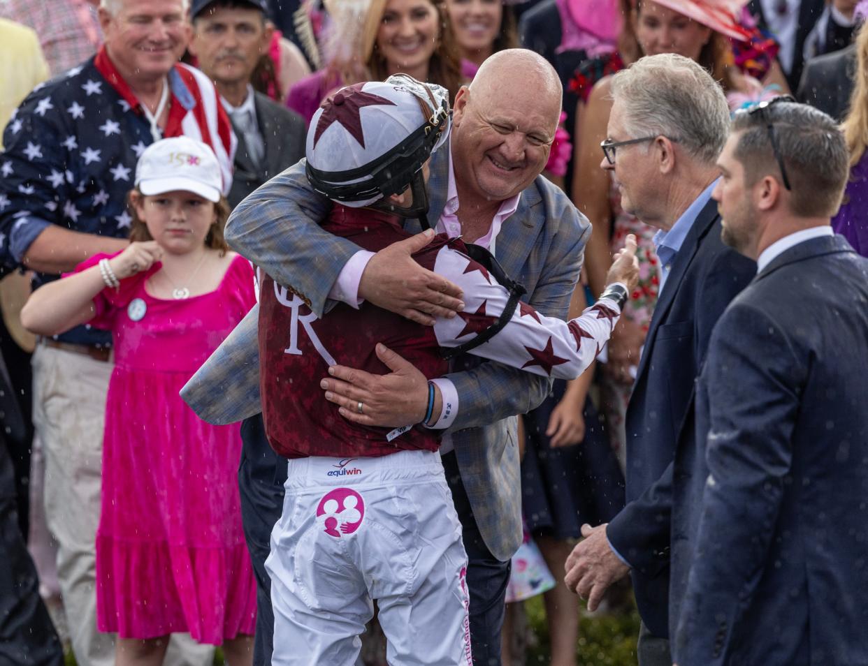 Jockey Brian Hernandez hugs trainer Kenny McPeek after winning the Kentucky Oaks aboard Thorpedo Anna. May 3, 2024.