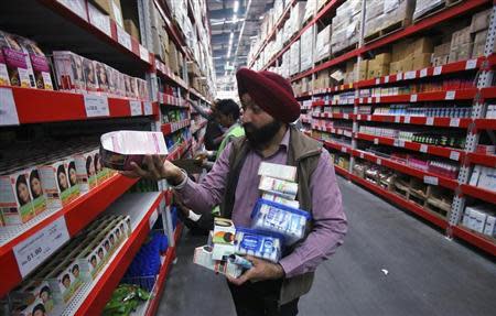 A customer shops at a Best Price Modern Wholesale store, a joint venture of Wal-Mart Stores Inc and Bharti Enterprises, at Zirakpur in Punjab December 6, 2012. REUTERS/Ajay Verma/Files