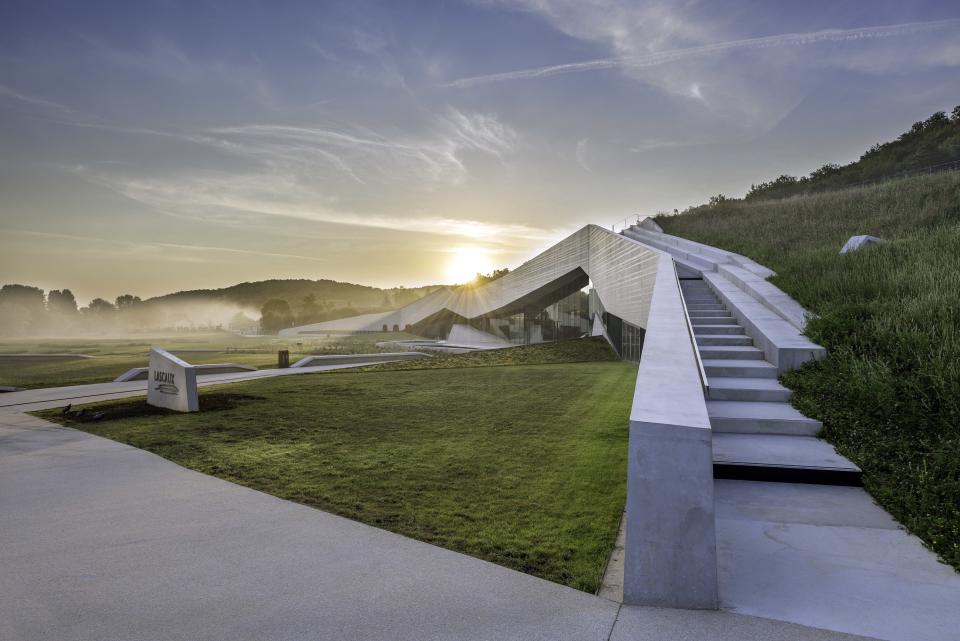 Completed in 2016, <strong>Lascaux IV</strong>: The International Centre for Cave Art is cut into the landscape of Montignac, France, connecting the building to the terrain. The building contains the fourth and most ambitious reconstruction of the prehistoric cave paintings and immerses visitors with 2,950-foot resin-rock reproductions covered with 1,900 paintings and engravings.