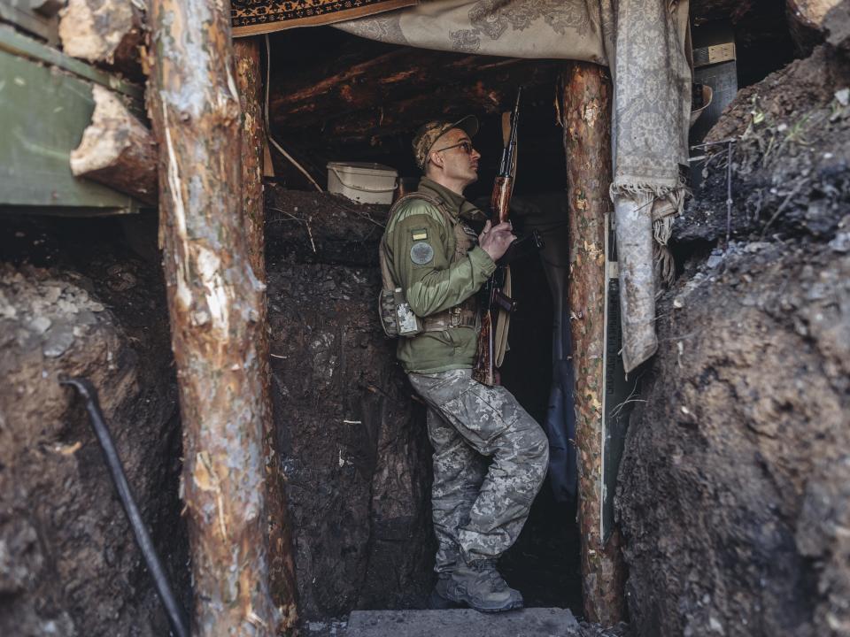 Ukrainian soldier of the 80th Brigade with a AK-47 in a trench in the direction of Bakhmut, 26 March 2023.