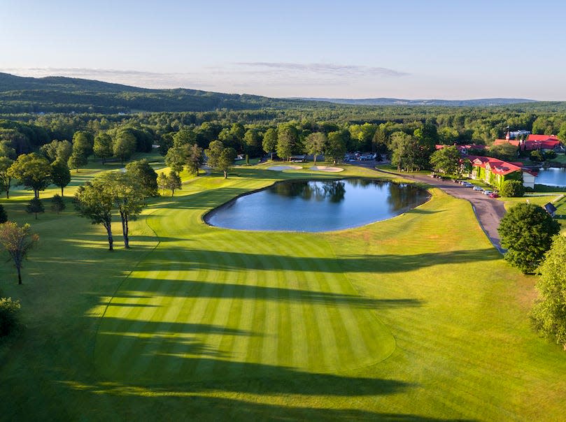 The famed 18th fairway and green, just after sunrise, on The Heather Golf Course at Boyne Highlands in Harbor Springs.