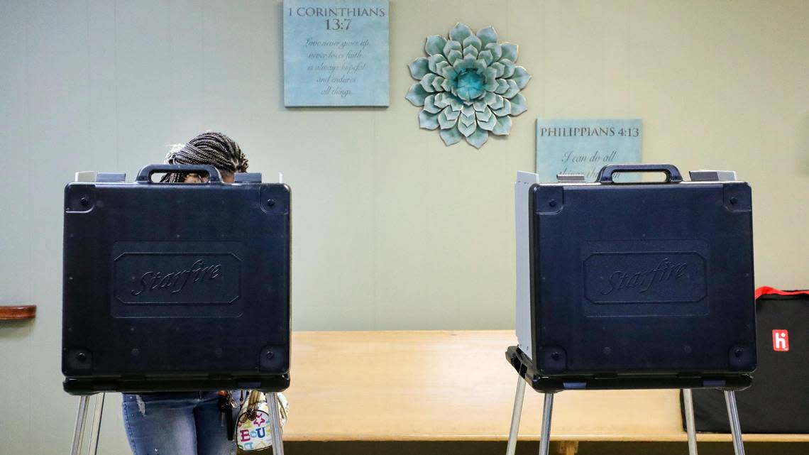 A voter cast their ballot at the Ohio-Walnut precinct in the Greater Liberty Baptist Church on Chestnut Street on election day, Tuesday, Nov. 8, 2022 in Lexington, Ky.