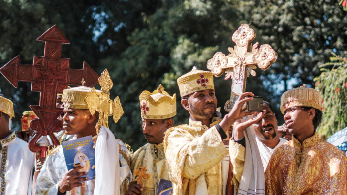 Ethiopian Orthodox deacons stand during the burial ceremony for Bishop Merkorios at the Trinity Cathedral in Addis Ababa, Ethiopia - Sunday 13 March 2022