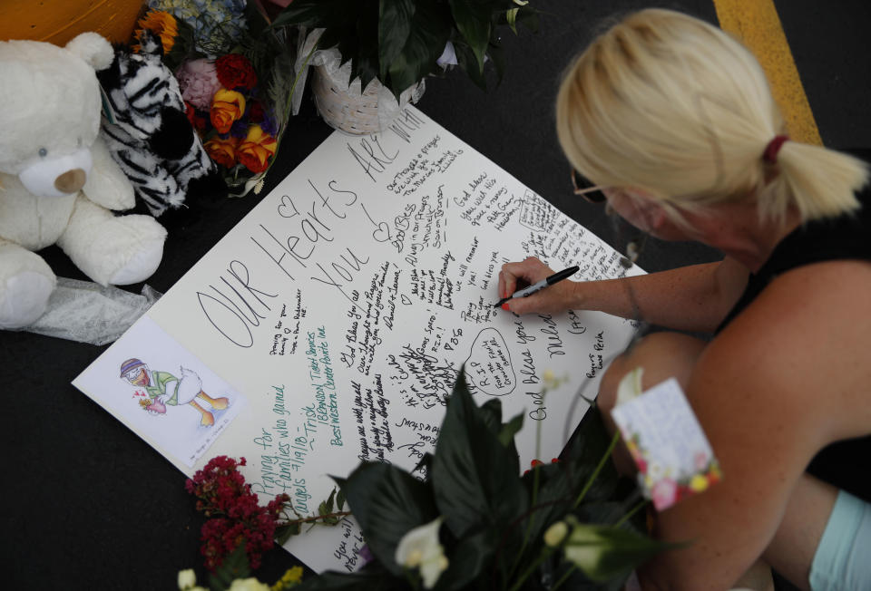 <em>Tributes – people have paid tribute to the 17 people who lost their lives in the accident (Picture: AP)</em>