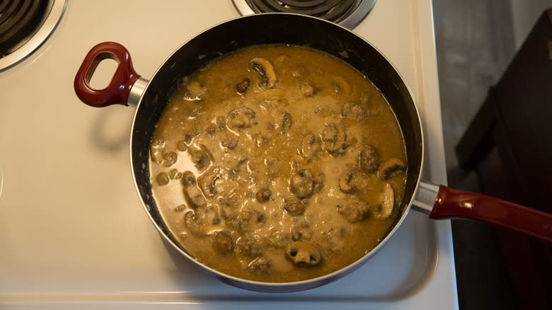 creamy mushroom sauce in pan 