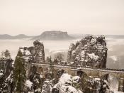 <p>Basteibrücke lies in south of Dresden, close to the border of the Czech Republic in a natural park known as Saxon Switzerland. The snowcapped mountains served as a backdrop for Zero and Agatha's wedding, the iron and stone structure a perfect nod to the time period.</p>