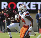 Syracuse running back Sean Tucker (34) runs for a touchdown past Virginia Tech defensive back Armani Chatman (27) during the first half of of an NCAA college football game in Blacksburg Va., Saturday, Oct. 23 2021. (Matt Gentry/The Roanoke Times via AP)