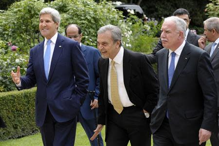 U.S. Secretary of State John Kerry (L) talks with members of the Arab League Peace Initiative, Saudi Foreign Minister Saud al Faisal (C) and Palestinian Foreign Minister Riyad al-Malki (R), following their meeting at the U.S. Embassy in Paris September 8, 2013. REUTERS/Susan Walsh/Pool