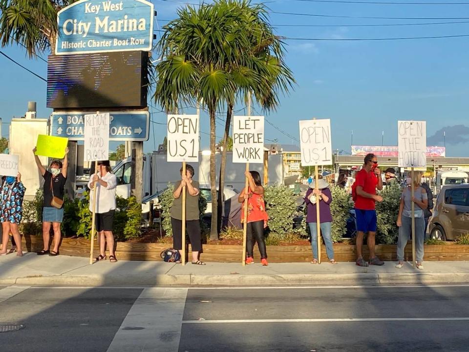 Protesters lined Palm Avenue in Key West on May 12, 2020, demanding the county take down the checkpoints to let in non-residents so they can spend money locally.