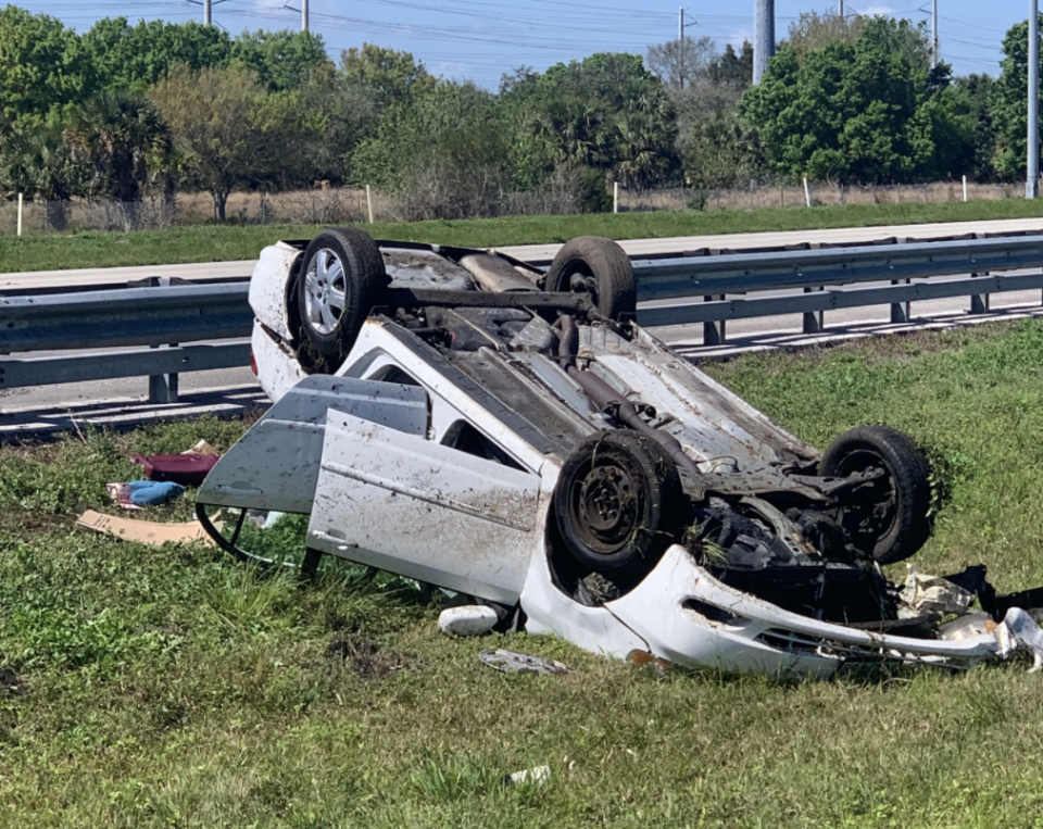 A crashed car, overturned, is seen in Florida.