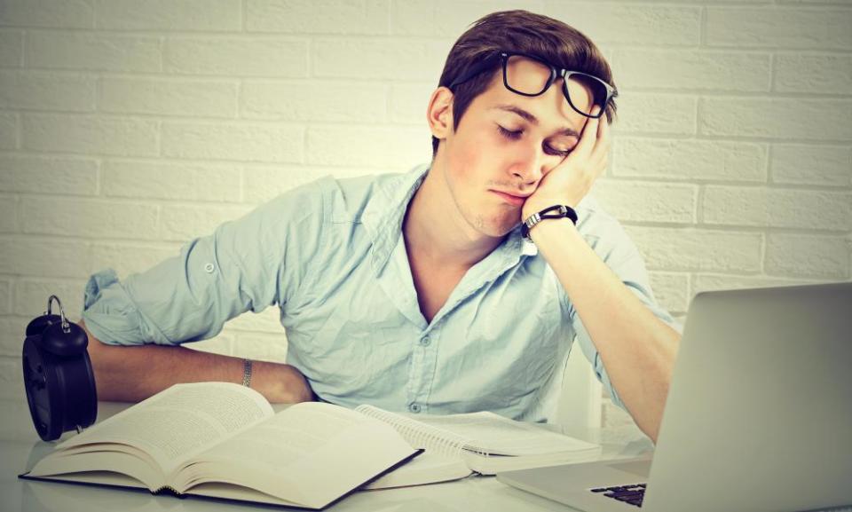 Tired man sitting at a desk