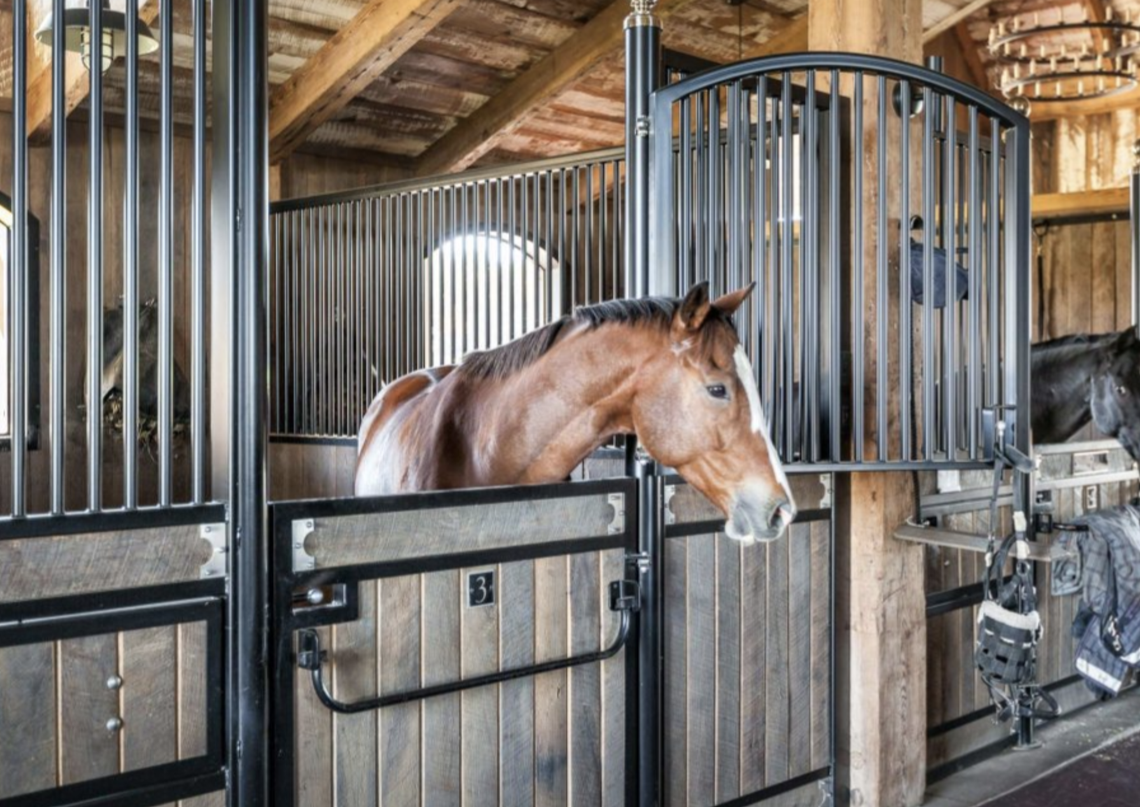 The estate has a 12-stall horse barn. Horses included in $22 million asking price.