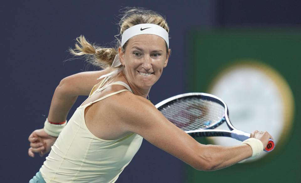 Victoria Azarenka, of Belarus, returns a volley from Camila Giorgi, of Italy, in the second set of a match at the Miami Open tennis tournament, Thursday, March 23, 2023, in Miami Gardens, Fla. (AP Photo/Jim Rassol)