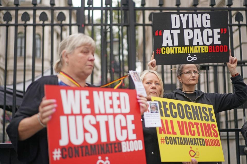 Infected blood campaigners call for ‘justice’ outside Downing Street (PA Wire)