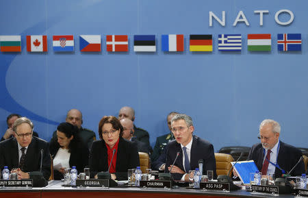 Georgia's Minister of Defence Tinatin Khidasheli (L) and NATO Secretary General Jens Stoltenberg (R) address a NATO-Georgia Commission defense ministers meeting at the Alliance's headquarters in Brussels February 11, 2016. REUTERS/Yves Herman