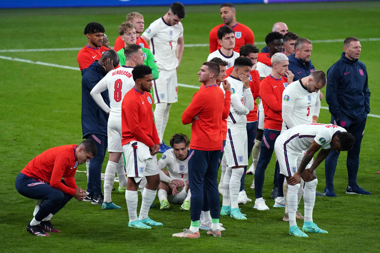 England players stand dejected following the UEFA Euro 2020 Final at Wembley Stadium, London. Picture date: Sunday July 11, 2021.