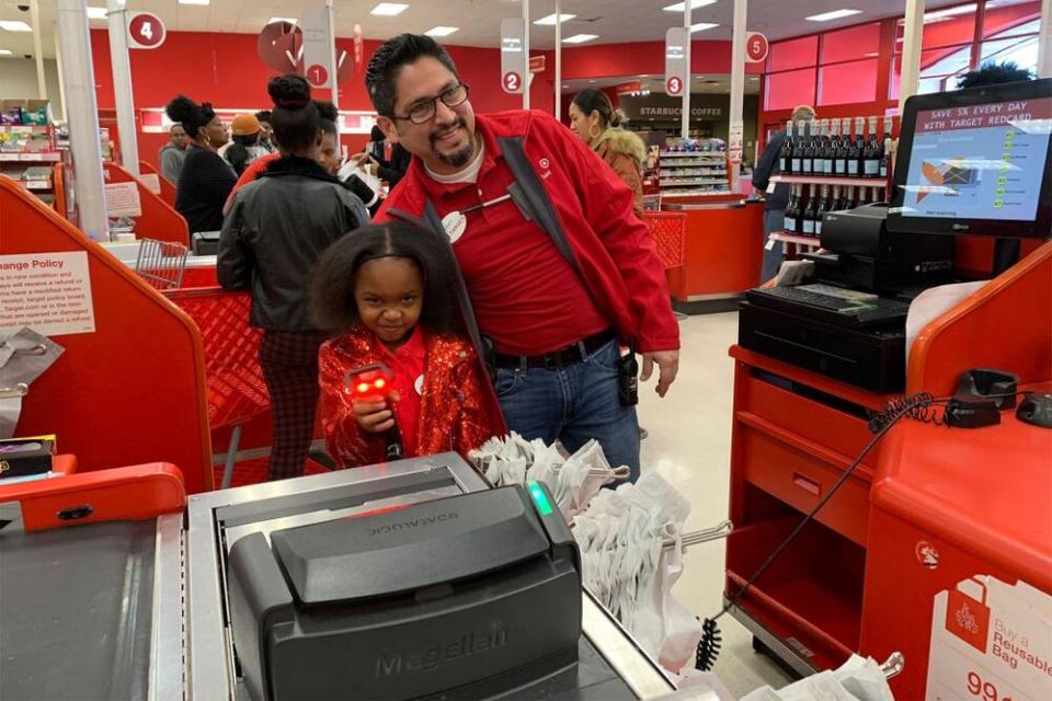 Brayden Lawrence with a Target employee | Rikki Jackson; Bailey Lawrence