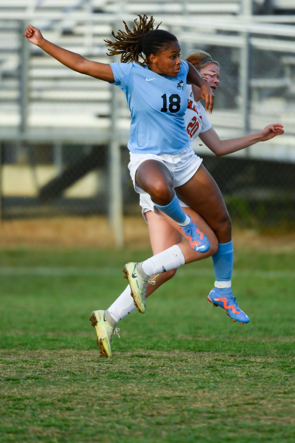 JL Mann's Trinity Oglesby (18) crashes into Mauldin's Mallory Zeleznik (20) during a game that resulted in a 1-0 win over Mauldin during the Upper State soccer playoffs at JL Mann High School on Wednesday, May 10, 2023. 