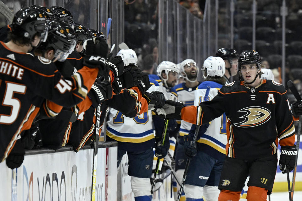 Anaheim Ducks right wing Troy Terry, right, gets congratulations from teammates after scoring against the St. Louis Blues during the first period of an NHL hockey game in Anaheim, Calif., Saturday, March 25, 2023. (AP Photo/Alex Gallardo)