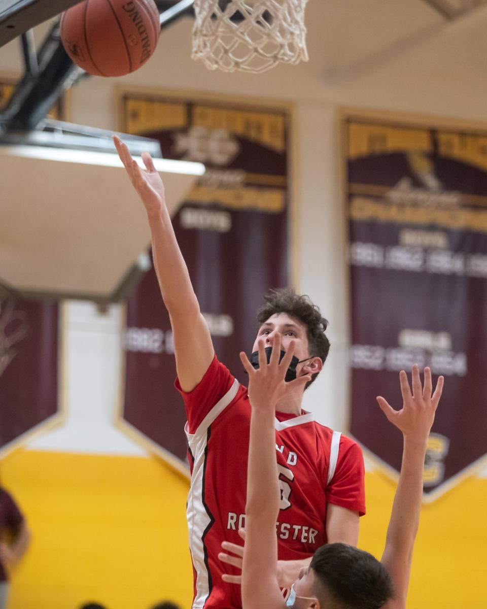 Old Rochester’s Dylan Hartley-Matteson lays it off the backboard through traffic on Monday at Case.