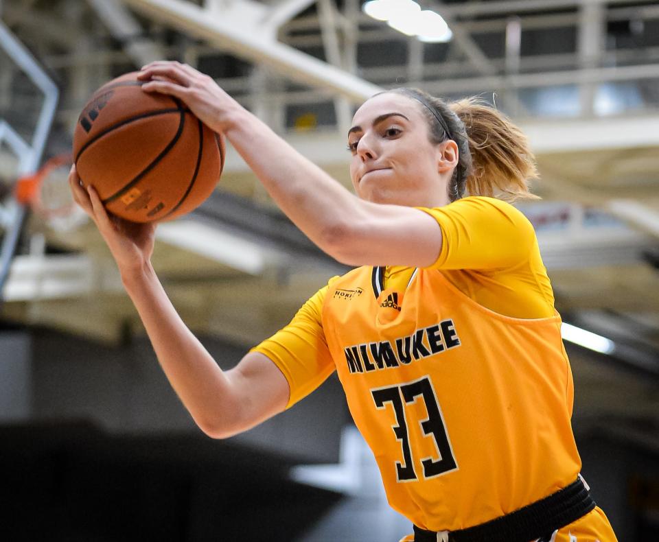 Milwaukee Panthers forward Megan Walstad (33) grabs the rebound against the Wisconsin Badgers on Wednesday, November 24, 2021, at the Klotsche Center in Milwaukee, Wisconsin. UW-Milwaukee won, 79-67.