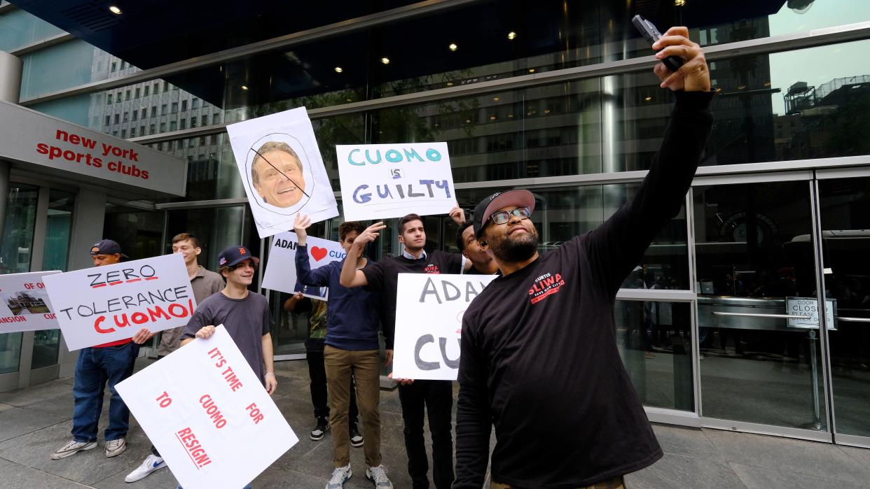 Republican New York City mayoral candidate Curtis Sliwa supporters take a selfie outside New York Gov. Cuomo's office in Manhattan, New York on Aug. 4, 2021.