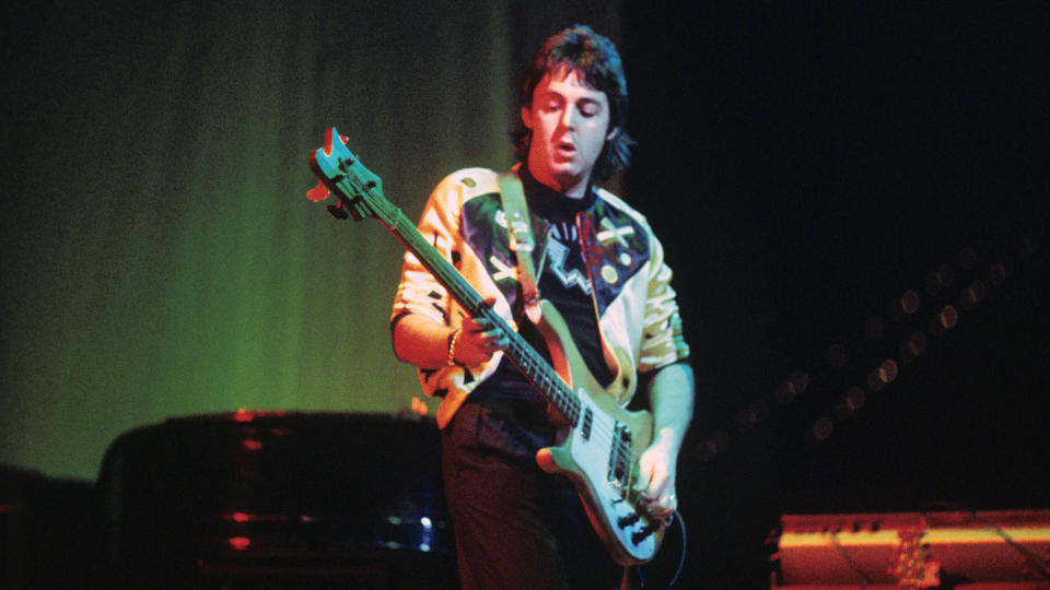 Paul McCartney performs live on stage with Wings at Ahoy on 25th March 1976 in Rotterdam, Netherlands. He plays a Rickenbacker 4001S bass guitar.