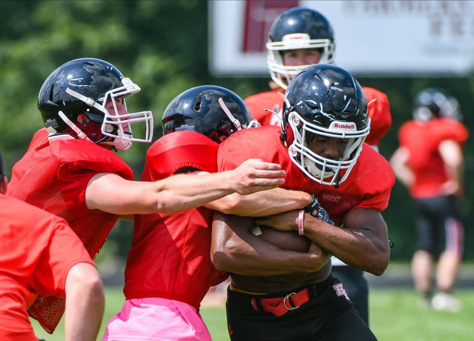 Eastern Greene’s James Lewis (right) runs through a drill during practice at Eastern Greene on Tuesday, August 8, 2023.