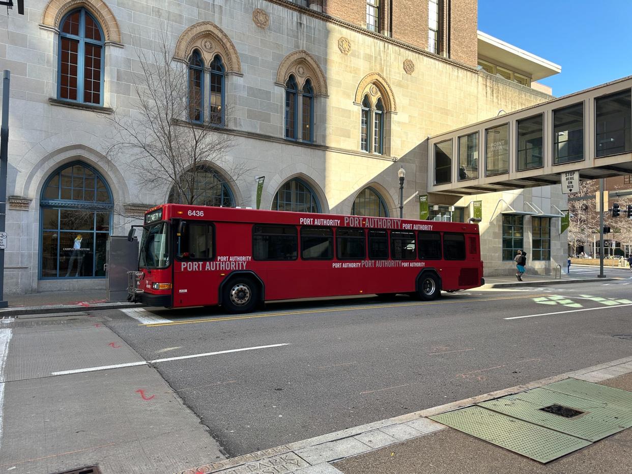 A red Port Authority bus in downtown Pittsburgh.