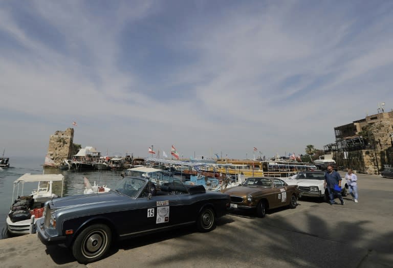 Cars line up in Byblos port as they take part in the "Rallye des Graces" in the Lebanese coastal city north of Beirut, on May 19, 2018