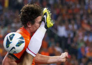 Daryl Janmaat of the Netherlands is kicked by Arda Turan of Turkey during their 2014 World Cup qualifying soccer match in Amsterdam September 7, 2012. REUTERS/Michael Kooren (NETHERLANDS - Tags: SPORT SOCCER TPX IMAGES OF THE DAY)