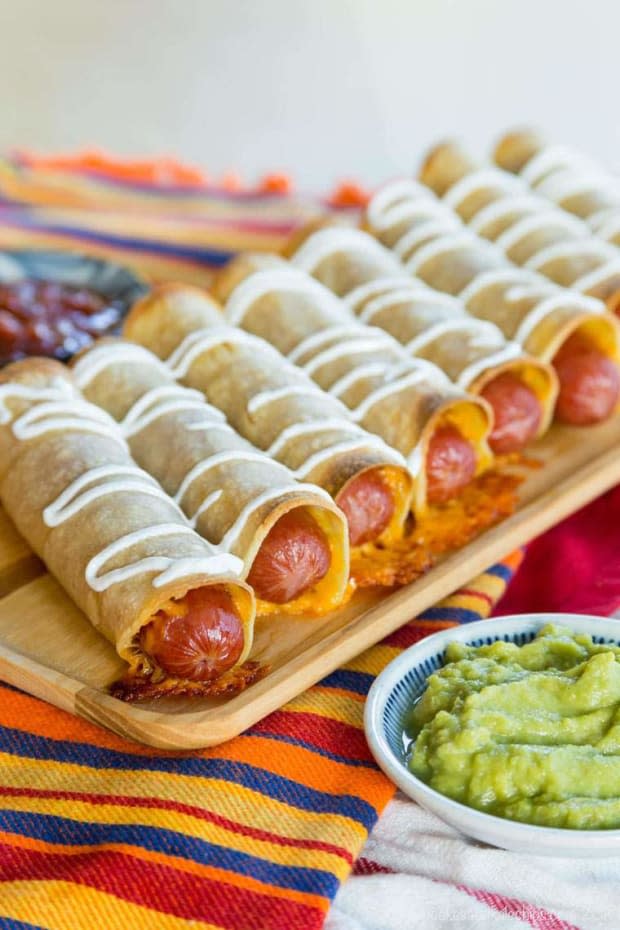 <p><a href="https://cupcakesandkalechips.com/cheesy-hot-dog-taquitos/" rel="nofollow noopener" target="_blank" data-ylk="slk:Cupcakes & Kale Chips;elm:context_link;itc:0;sec:content-canvas" class="link ">Cupcakes & Kale Chips</a></p>