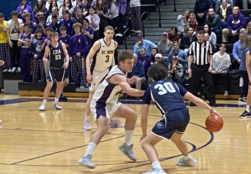 CBA's Peter Noble (30) drives against St. Rose's Bryan Eberling during St. Rose's 61-39 win in a Shore Conference Tournament quarterfinal Saturday at Middletown South.