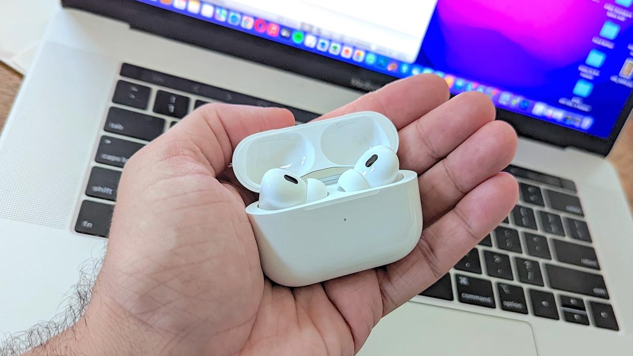  Apple AirPods Pro 2 in hand of reviewer  . 