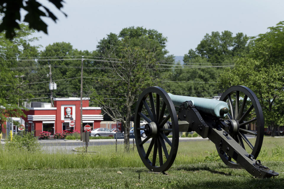 In this June 5, 2013 file photo shown is a businesses on Steinwehr Avenue near the Gettysburg National Military Park, in Gettysburg, Pa. As the 150th anniversary of the Battle of Gettysburg draws near the character and historic legacy of the town remain divided as hundreds of thousands of tourists visit the battlefield where so many died and development continues unabated around the site, drawing outlet shopping, restaurants and a casino. (AP Photo/Matt Rourke, File)