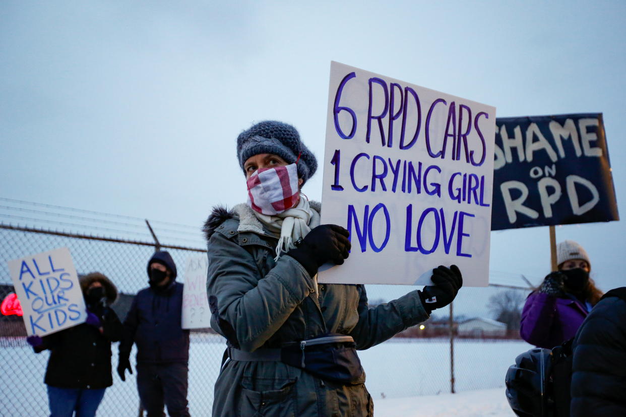 People protest after police handcuffed and sprayed a chemical irritant at a nine-year-old girl in Rochester, New York, U.S., February 1, 2021.  REUTERS/Lindsay DeDario