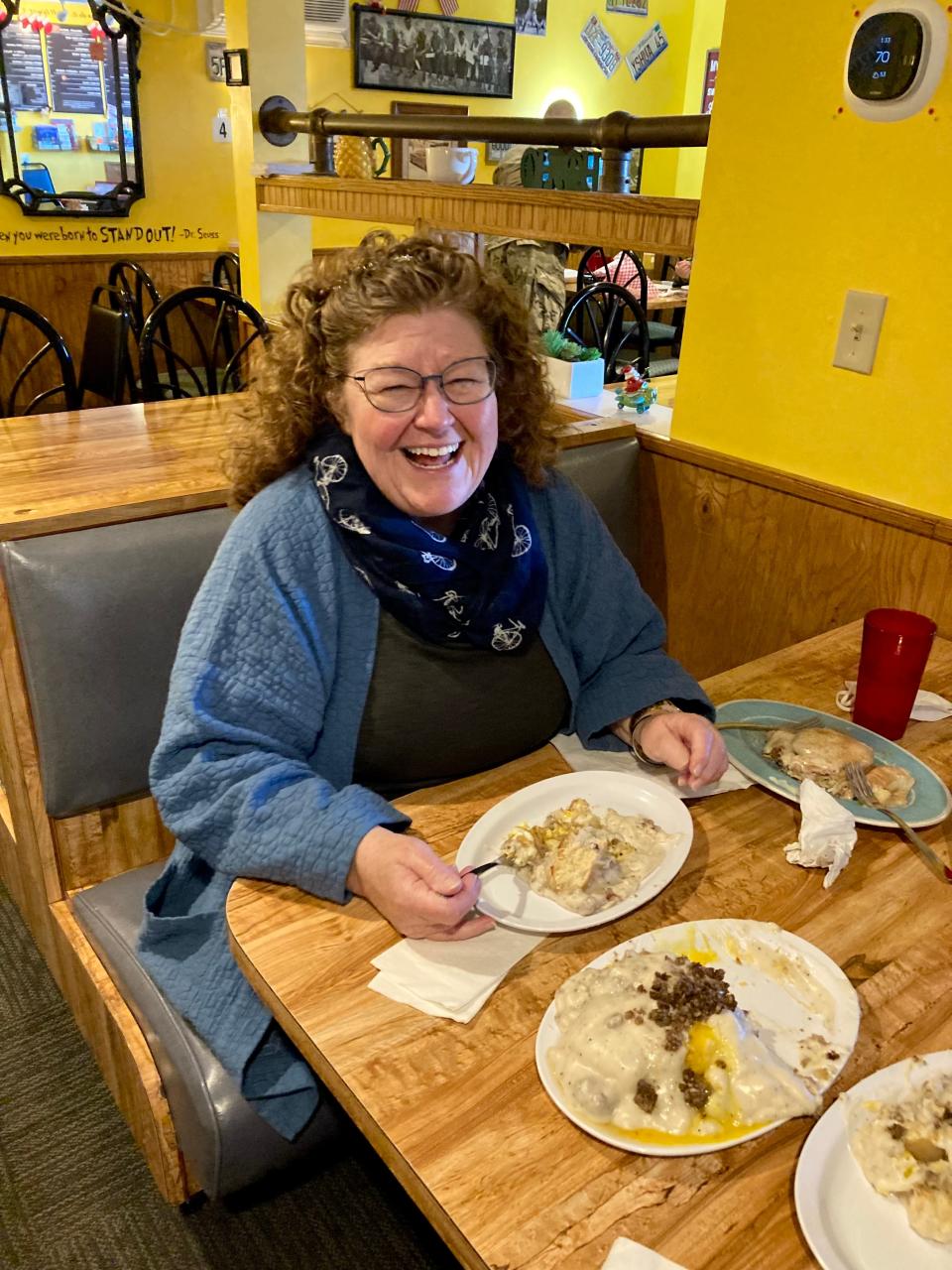 Kitty Rothwell enjoys breakfast food at Fidler's on the Grand on Wednesday, Dec. 16, 2021.