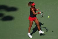 Mar 21, 2018; Key Biscayne, FL, USA; Naomi Osaka of Japan hits a forehand against Serena Williams of the United States (not pictured) on day two of the Miami Open at Tennis Center at Crandon Park. Osaka won 6-3, 6-2. Mandatory Credit: Geoff Burke-USA TODAY Sports