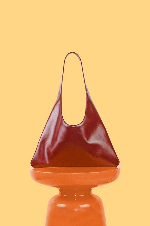 <p><a href="https://www.santosbymonica.com/product-page/agave-triangular-tote-in-red" rel="nofollow noopener" target="_blank" data-ylk="slk:Shop Now;elm:context_link;itc:0;sec:content-canvas" class="link ">Shop Now</a></p><p>Santos by Monica Agave Triangular Tote</p><p>santosbymonica.com</p><p>$315.00</p>