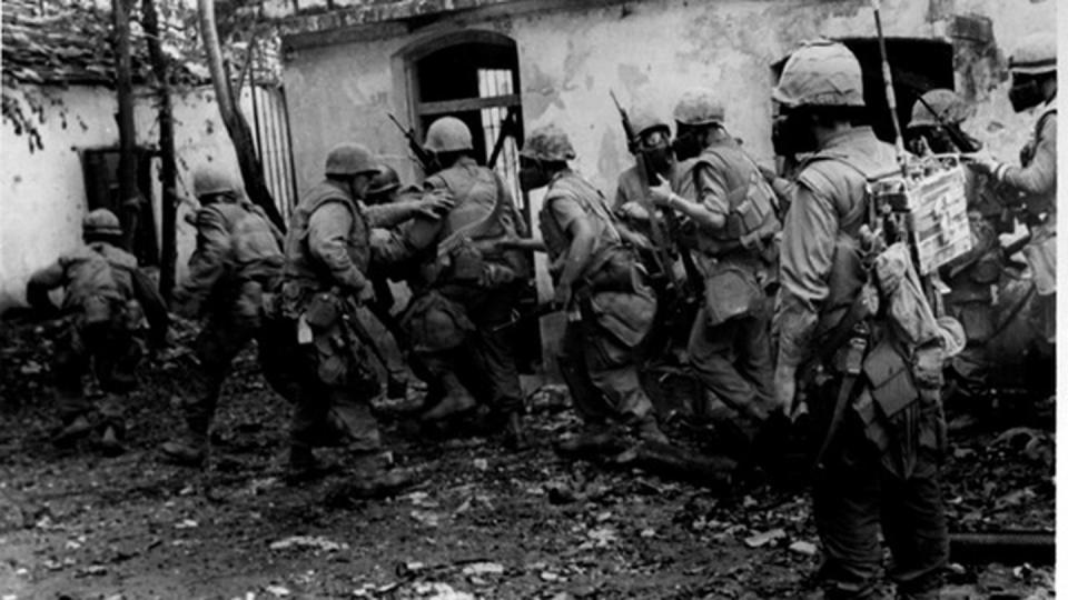 Leathernecks of H Company, 2nd Battalion, Fifth Marines combed the streets and alleys of battle-torn Hue in February 1968. (Sgt. W. F. Dickman/Marine Corps)