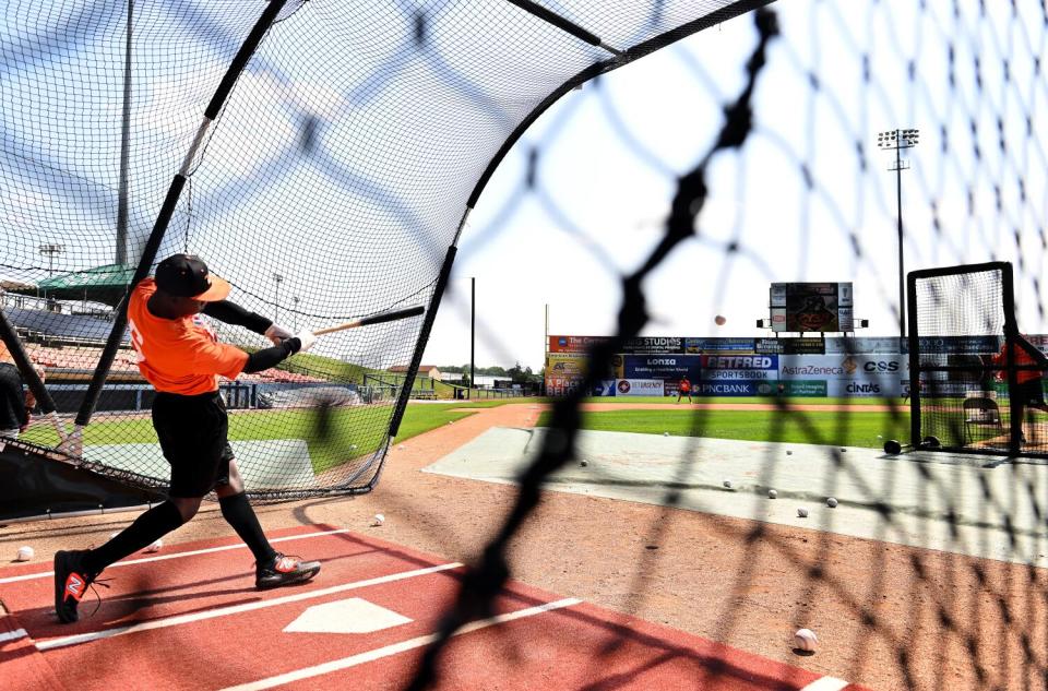 Frederick Keys player Dennis Kasumba takes batting practice during a workout.