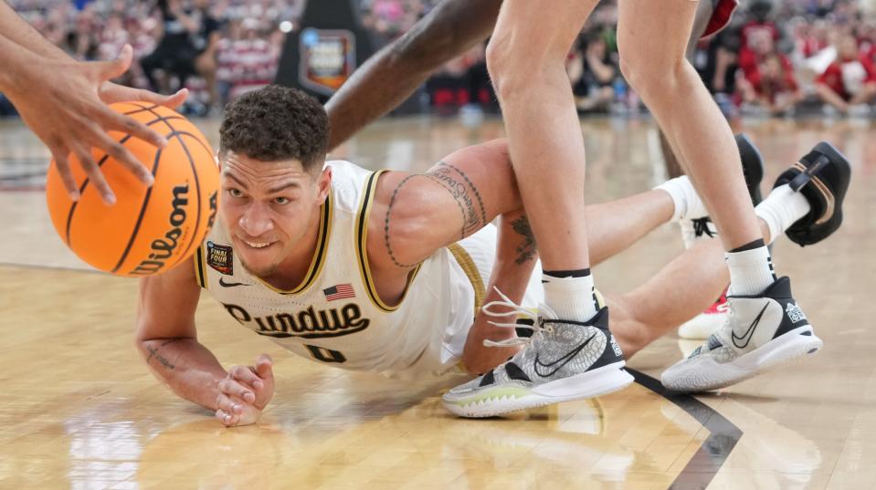 Purdue Boilermakers forward Mason Gillis (0) dives for the ball during the NCAA MenÃ¢â‚¬â„¢s Basketball Tournament Final Four game against the North Carolina State Wolfpack, Saturday, April 6, 2024, at State Farm Stadium in Glendale, Ariz.