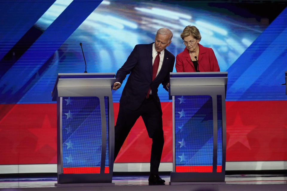 Democratic presidential candidates former Vice President Joe Biden and Sen. Elizabeth Warren, D-Mass. talk during a break Thursday, Sept. 12, 2019, at a Democratic presidential primary debate hosted by ABC at Texas Southern University in Houston. (AP Photo/David J. Phillip)