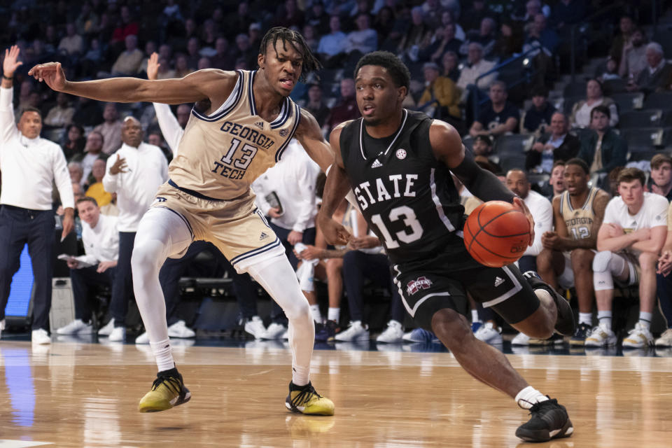 Mississippi State guard Josh Hubbard (13) drives to the basket pass Georgia Tech guard Miles Kelly (13) in the first half of an NCAA college basketball game Tuesday, Nov. 28, 2023, in Atlanta. (AP Photo/Hakim Wright Sr.)