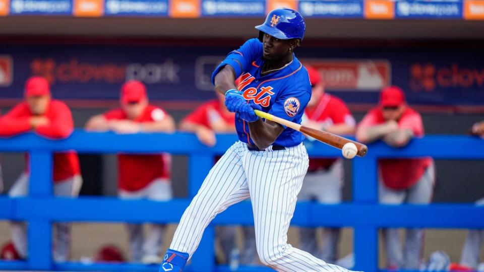 Mar 3, 2023; Port St. Lucie, Florida, USA; New York Mets shortstop Ronny Mauricio (60) hits a single against the Washington Nationals during the eighth inning at Clover Park.