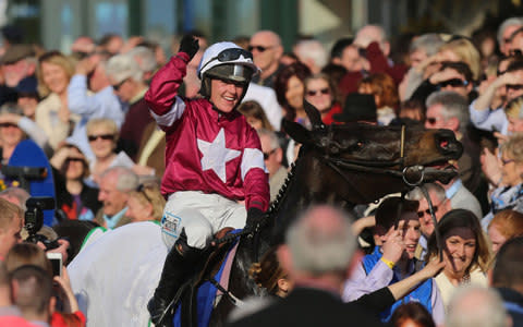 Katie Walsh celebrates after guiding Thunder And Roses to victory in The BoyleSports Irish Grand National Steeplechase  - Credit: Niall Carson/PA