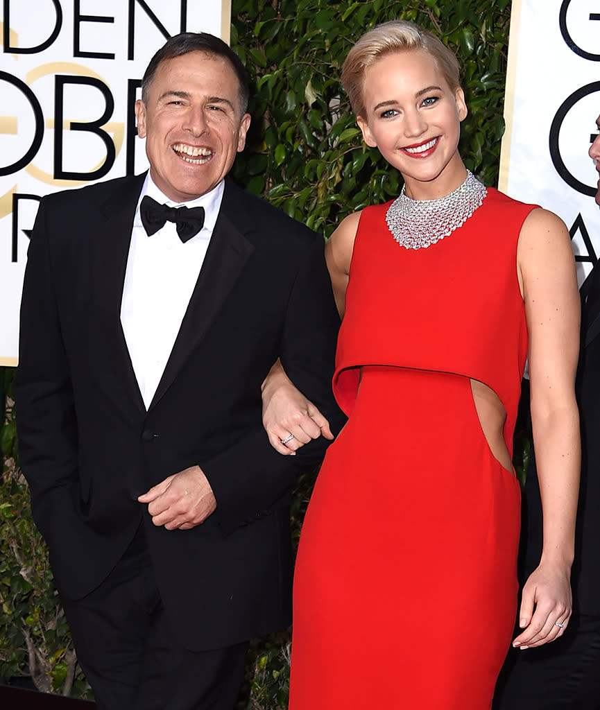 <p>Appearing in her third David O. Russell film <i>Joy </i>garnered Lawrence top acting nominations at all the major award shows — including the Oscars. She and the director arrive together to the 2016 Golden Globes on Jan. 10. <i>(Photo: Steve Granitz/WireImage)</i></p>