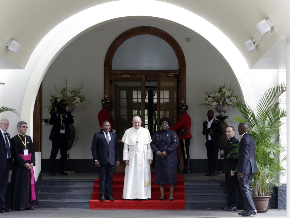 Pope Francis poses with Mozambique President Filipe Jacinto Nyusi, left, and his wife Isaura Nyusi at the Ponta Vermelha Palace on the occasion of their meeting, in Maputo, Mozambique, Thursday, Sept. 5, 2019. Francis is starting his first full day in Mozambique with a speech before government authorities and invited members of the armed opposition who just signed a permanent cease-fire to solidify the country's peace process. (AP Photo/Alessandra Tarantino)
