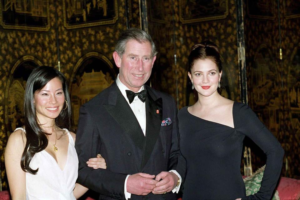 <p>Prince Charles was photographed with Lucy Lui and Drew Barrymore at St. James Palace in 2000.</p>