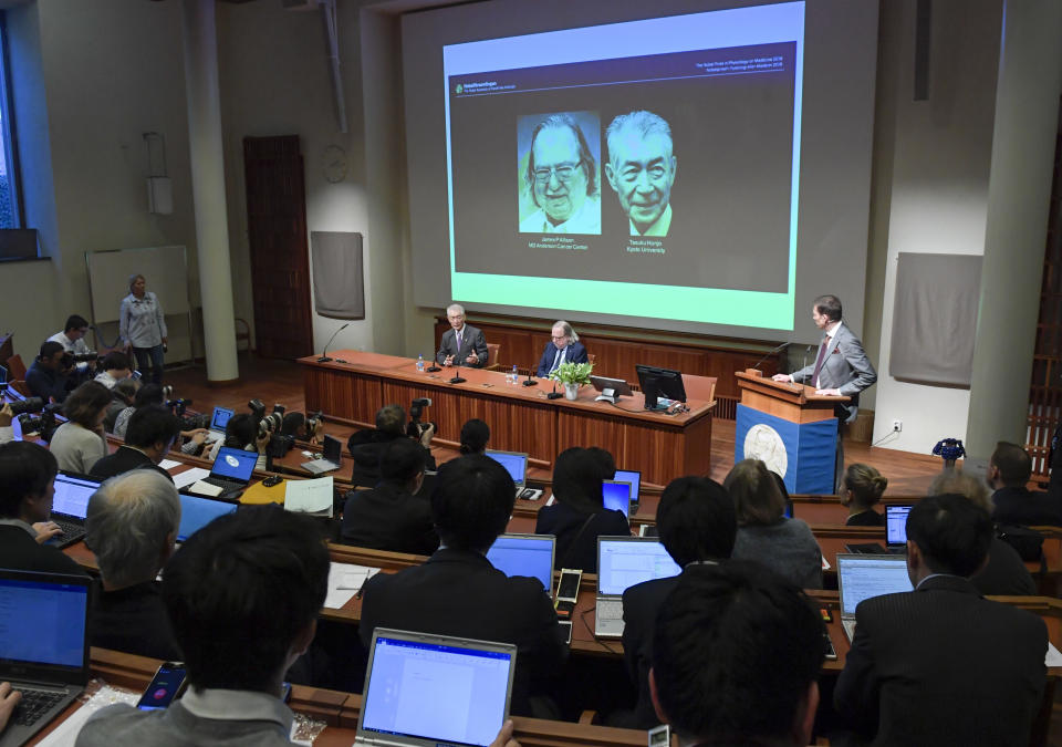 The 2018 Nobel laureates in Physiology or Medicine, Tasuko Honjo, left, and James P. Allison attend a press conference at the Karolinska Institutet, Stockholm, Sweden, Thursday Dec. 6, 2018. (Janerik Henriksson/TT via AP)